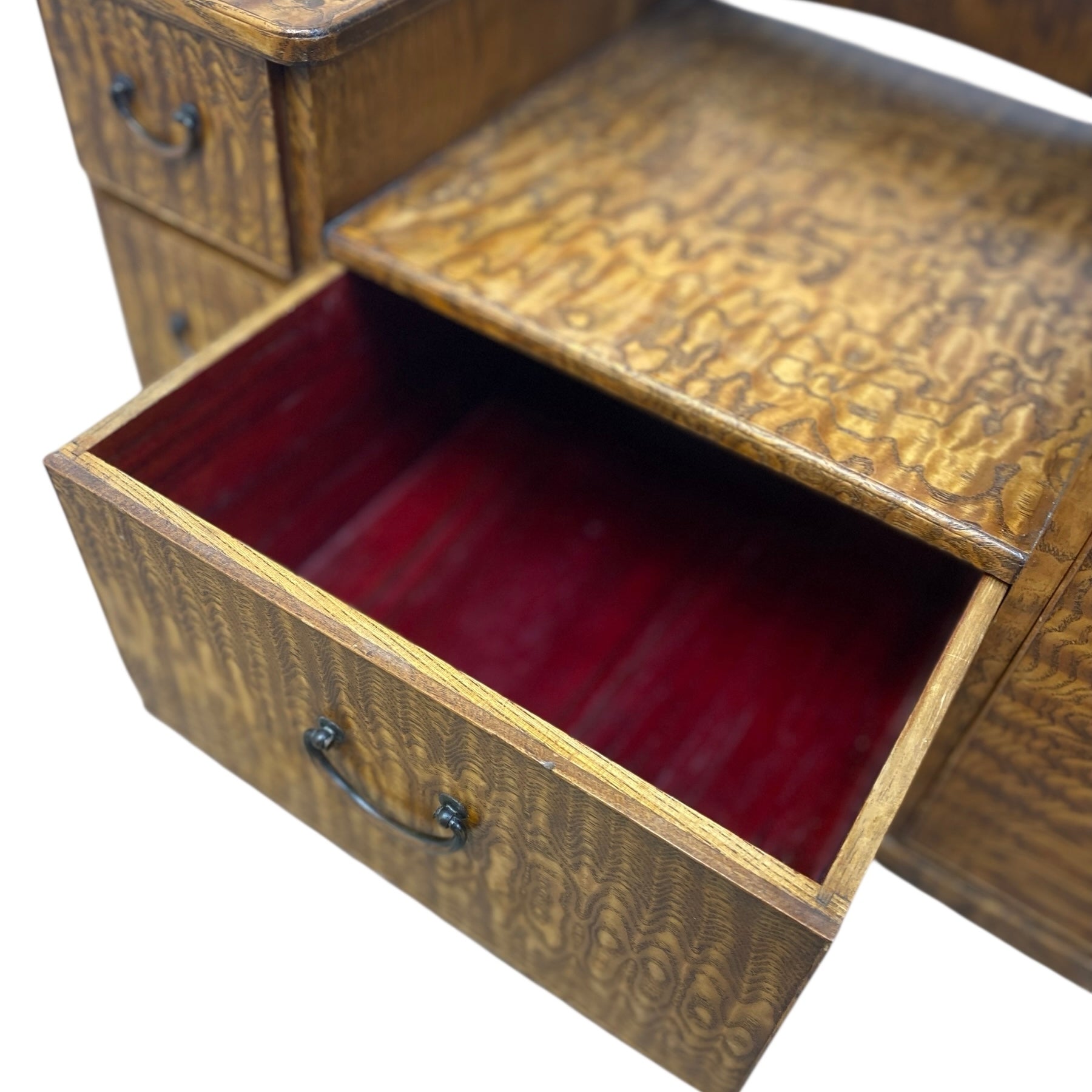 Wooden drawer with a red interior on a white background