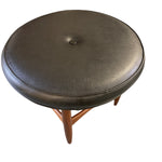 Load image into Gallery viewer, Round brown leather stool with wooden legs on a white background
