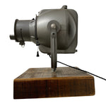 Load image into Gallery viewer, Vintage-style projector on a wooden base with a white background

