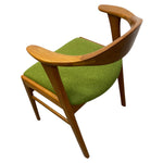 Load image into Gallery viewer, Chair with wooden frame and green cushion on a white background
