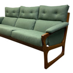 Load image into Gallery viewer, Green sofa with wooden frame on a white background
