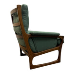 Load image into Gallery viewer, Green upholstered chair with wooden frame on a white background

