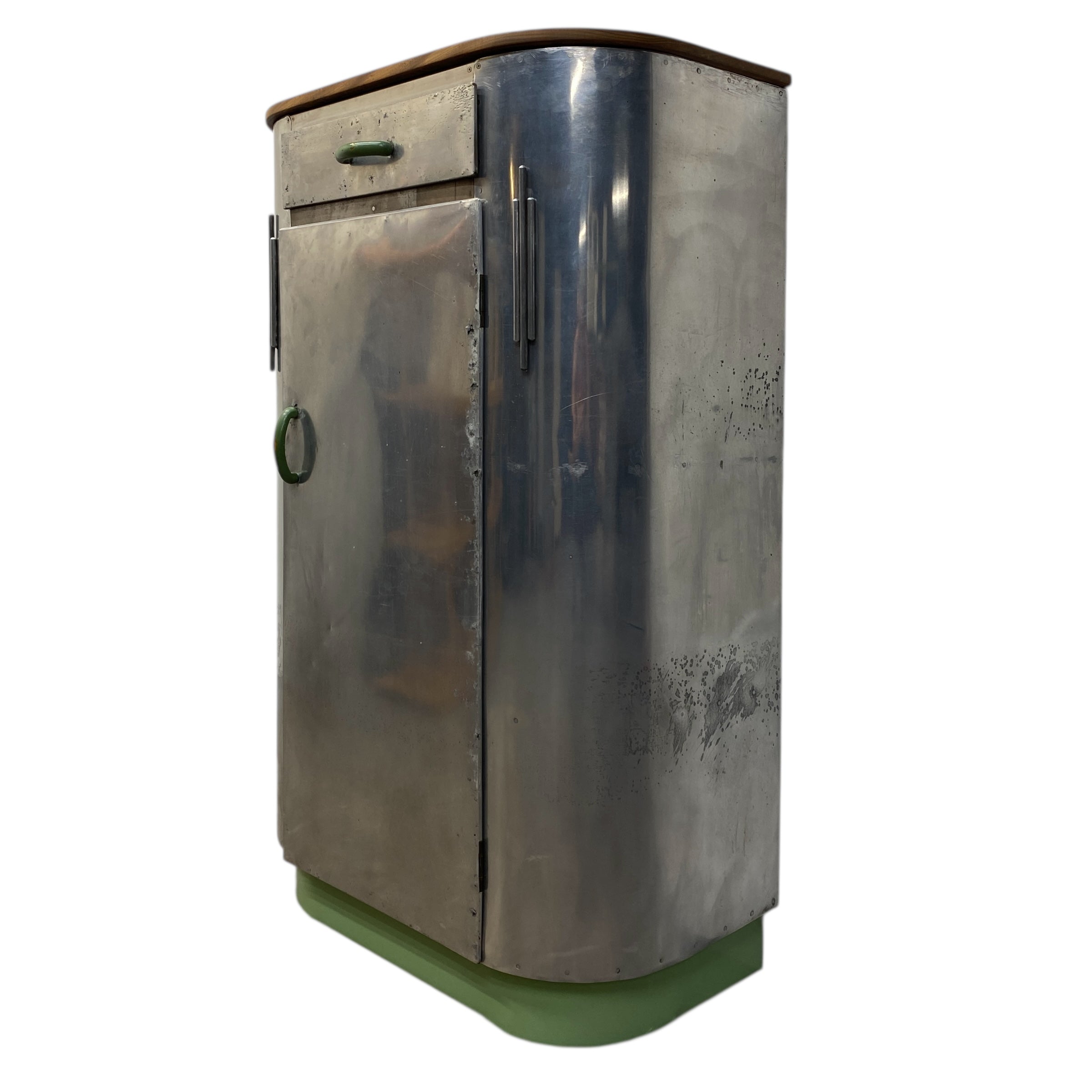 Metallic cylindrical object with a green base on a white background