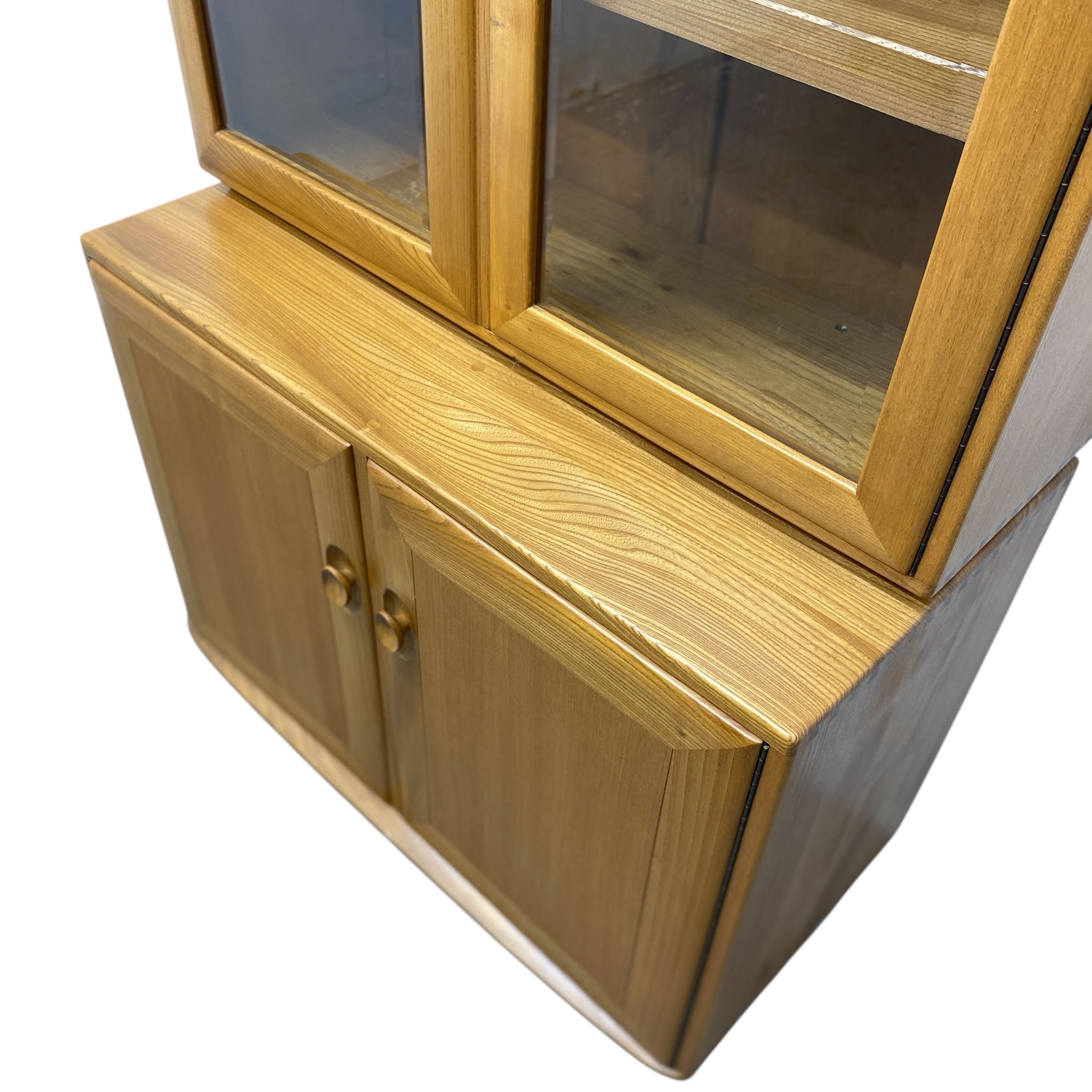 Wooden cabinet with glass doors on a white background