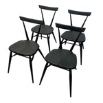 Load image into Gallery viewer, Four black wooden chairs on a white background
