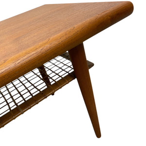 Wooden coffee table with a grid shelf on a white background