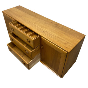 Wooden cabinet with drawers on a white background