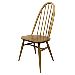 Wooden chair with curved backrest on a white background
