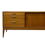 Load image into Gallery viewer, Wooden sideboard with drawers and a cabinet on a white background
