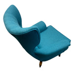 Load image into Gallery viewer, Blue armchair on a white background
