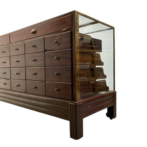 Wooden dresser with glass front on a white background
