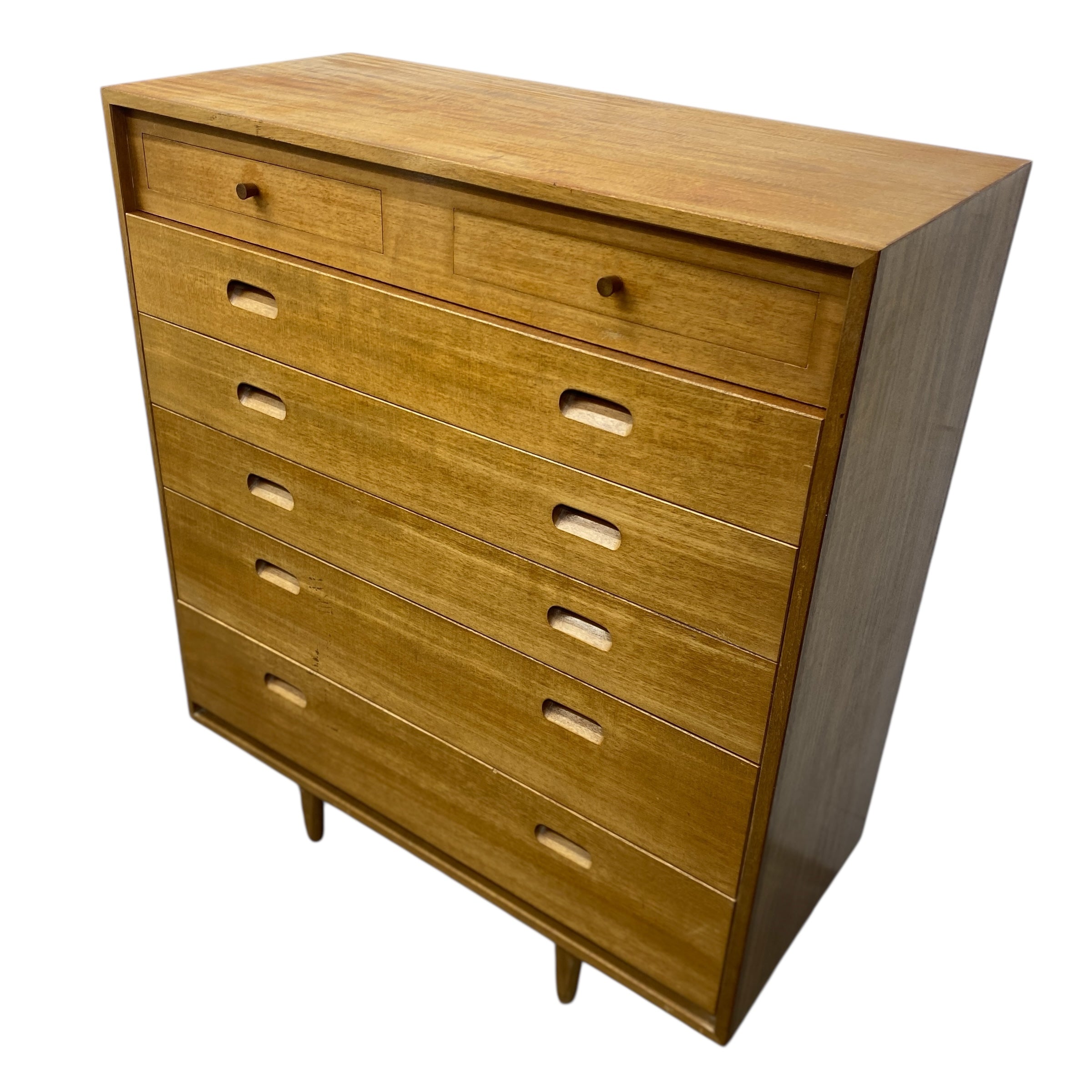 Wooden dresser with multiple drawers on a white background