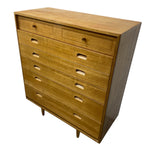 Load image into Gallery viewer, Wooden dresser with multiple drawers on a white background
