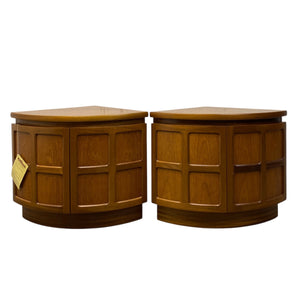 Two wooden side tables with a white background