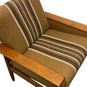 Chair with brown and beige striped cushions on a white background