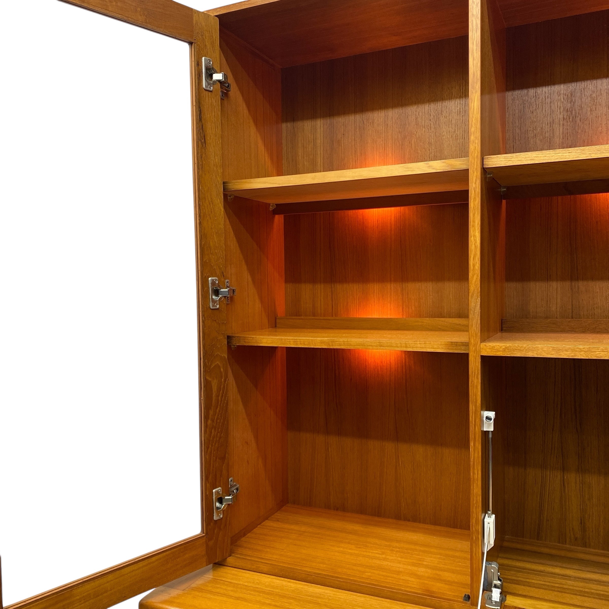 Wooden bookshelf with open doors on a white background