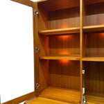 Load image into Gallery viewer, Wooden bookshelf with open doors on a white background
