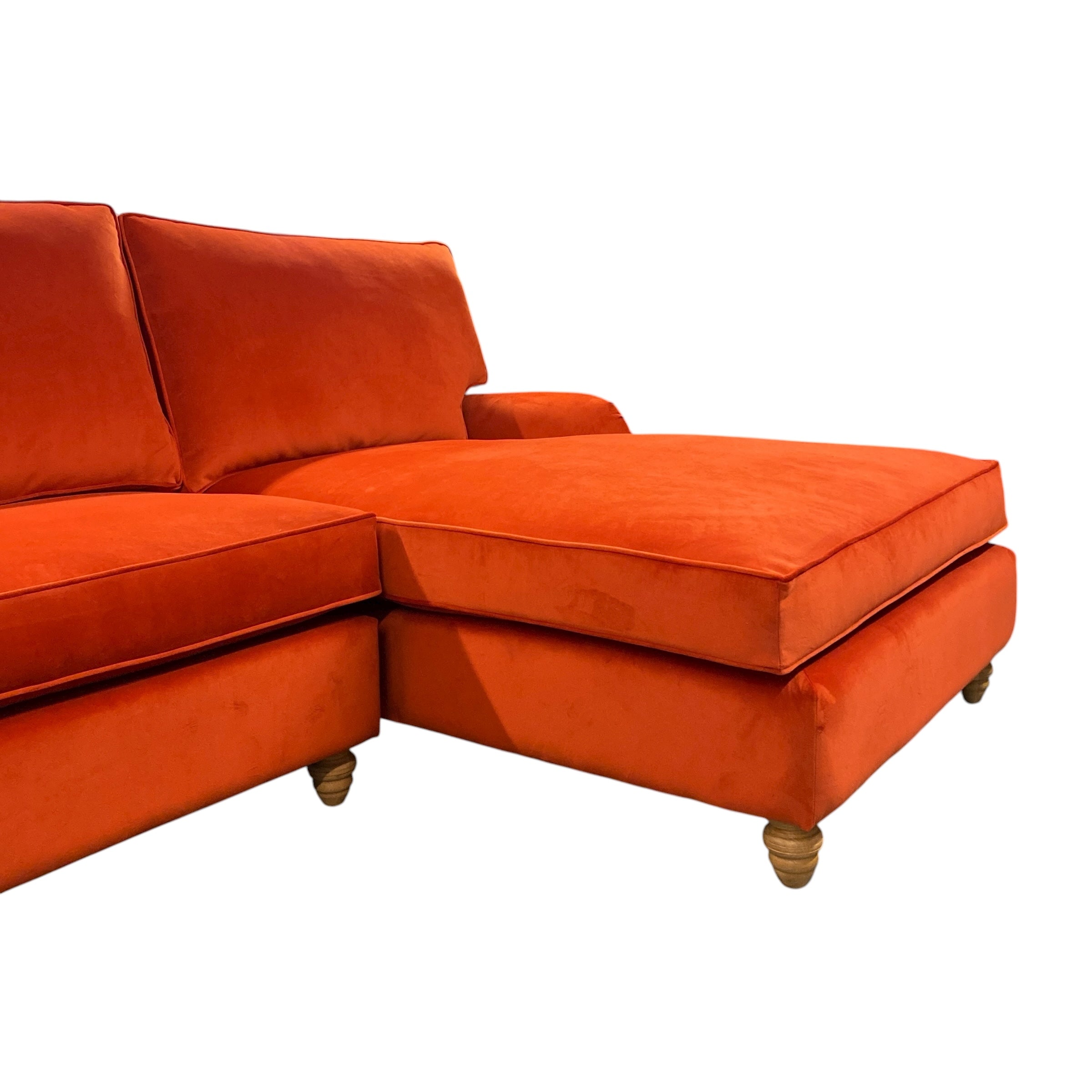 Orange sectional sofa on a white background
