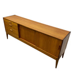 Load image into Gallery viewer, Wooden sideboard with drawers and a sliding door on a white background
