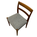 Load image into Gallery viewer, Wooden chair with a gray cushion on a white background
