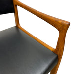 Load image into Gallery viewer, Chair with wooden armrests and black seat on a white background
