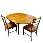 Load image into Gallery viewer, Wooden dining table with two chairs on a white background
