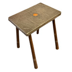 Load image into Gallery viewer, Small table with a textured surface and wooden legs on a white background
