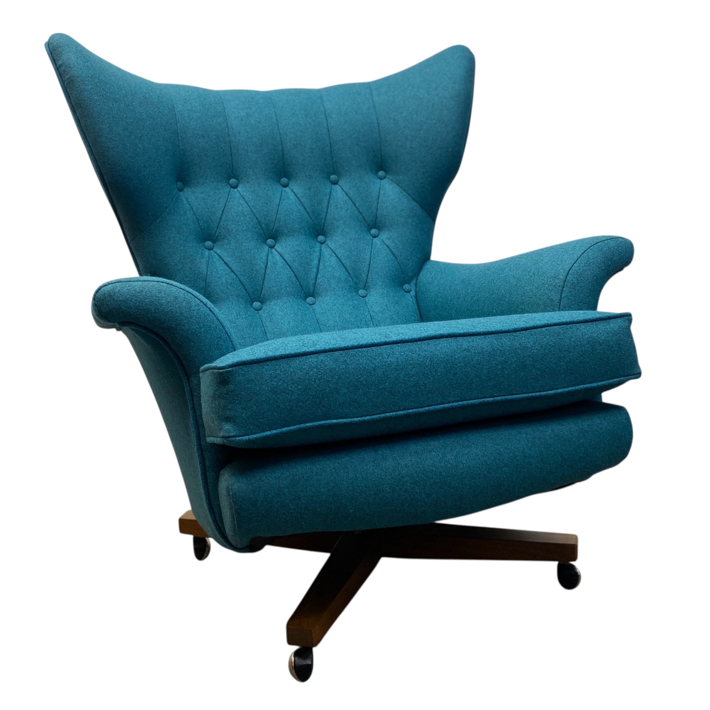 Blue armchair with tufted backrest on a white background
