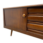 Load image into Gallery viewer, Wooden sideboard with a closed door on a white background
