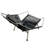 Load image into Gallery viewer, Modern lounge chair with black seat and mesh back on a white background
