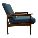 Load image into Gallery viewer, Blue upholstered armchair with wooden frame on a white background
