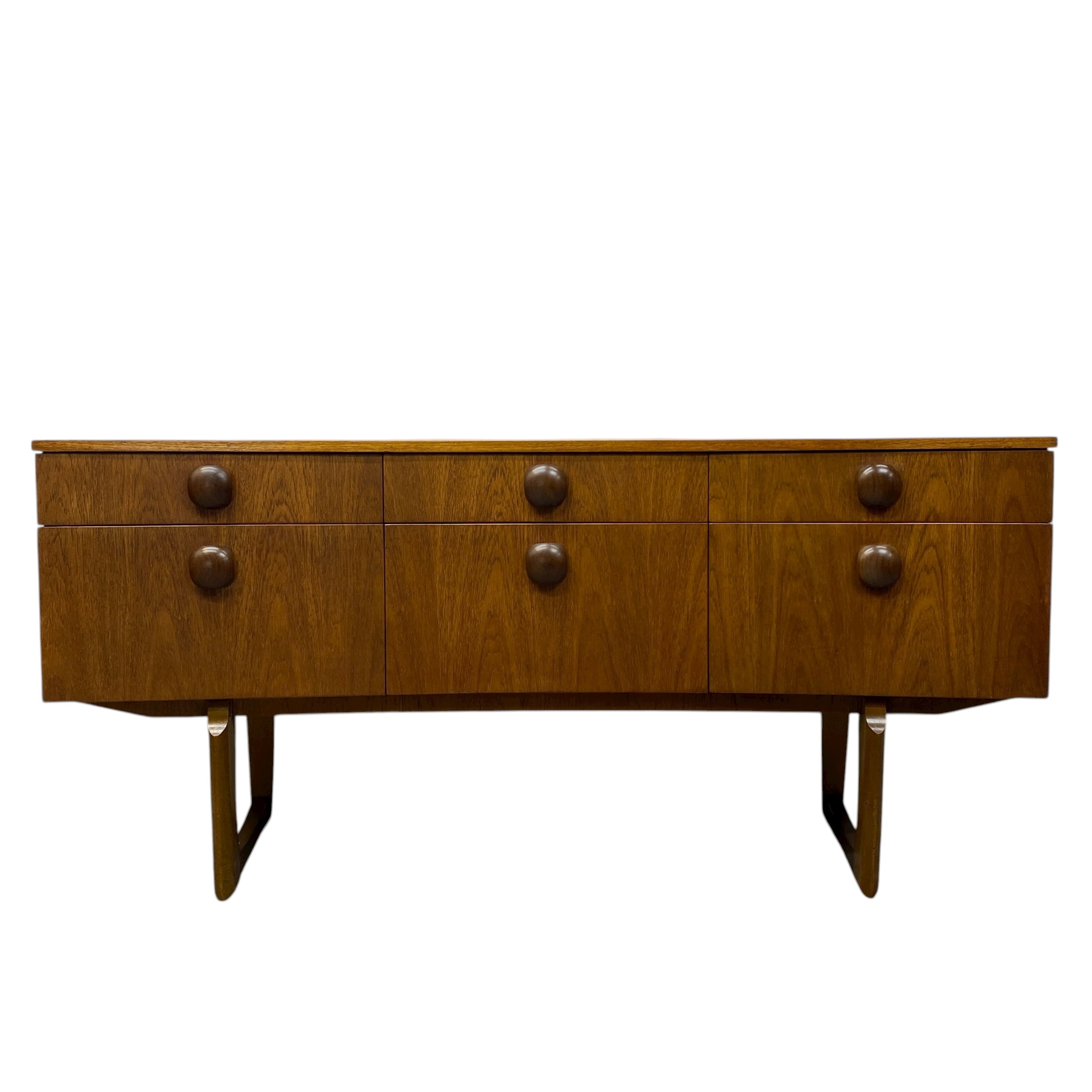 Wooden sideboard with six drawers on a white background