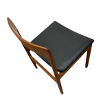 Load image into Gallery viewer, Chair with wooden frame and black cushion on a white background
