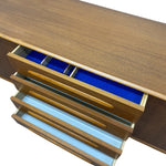 Load image into Gallery viewer, Wooden console table with open drawers revealing blue and gold interior.
