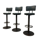 Load image into Gallery viewer, Three black bar stools with adjustable seats on a white background
