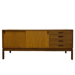 Load image into Gallery viewer, Wooden sideboard with sliding doors and drawers on a white background
