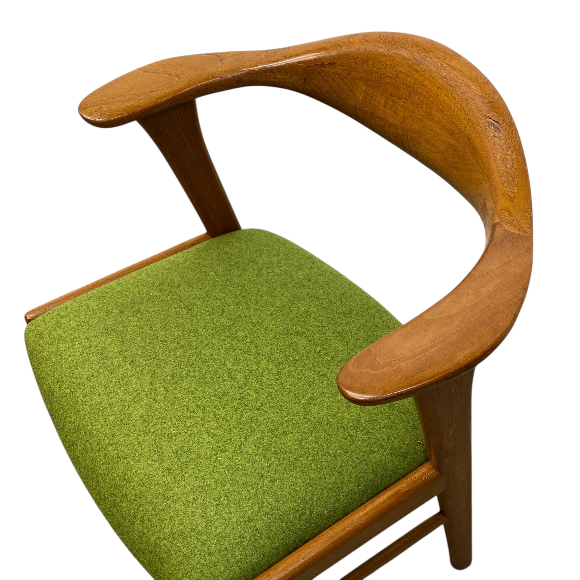 Chair with wooden armrests and green cushion on a white background