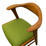 Load image into Gallery viewer, Chair with wooden armrests and green cushion on a white background
