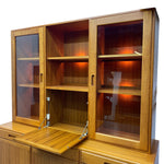 Load image into Gallery viewer, Wooden cabinet with glass doors on a white background

