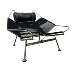 Load image into Gallery viewer, Modern lounge chair with black mesh seat and backrest on a white background
