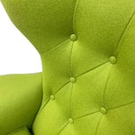 Load image into Gallery viewer, Close-up of a green upholstered chair with tufted backrest on a white background
