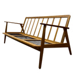 Load image into Gallery viewer, Wooden sofa with slatted backrest on a white background
