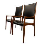 Load image into Gallery viewer, Two wooden chairs with black leather seats on a white background
