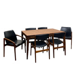 Load image into Gallery viewer, Wooden dining table with six black chairs on a white background
