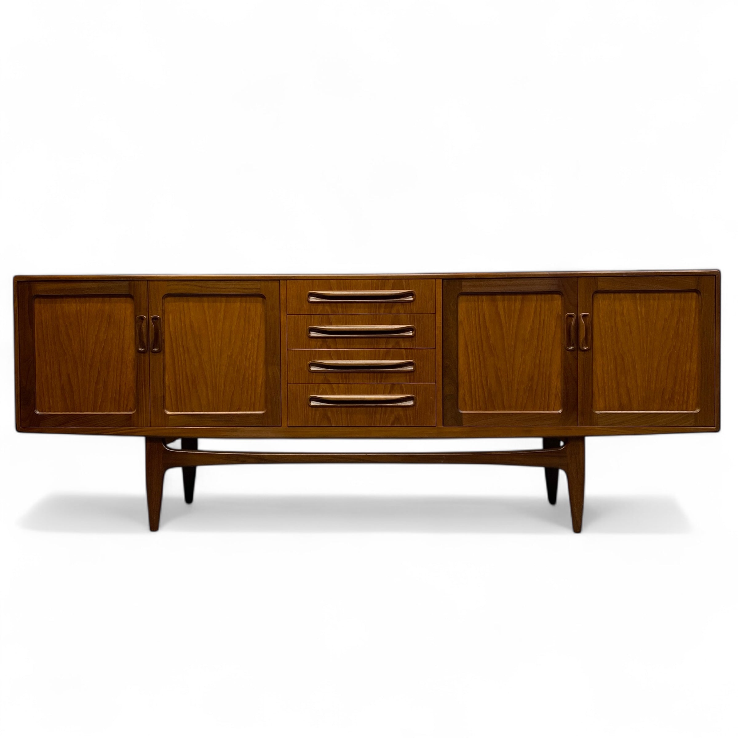 G PLAN Wooden sideboard with four doors and two drawers on a white background