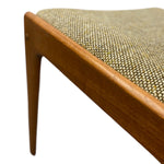 Load image into Gallery viewer, Close-up of a wooden chair with a textured fabric seat on a white background
