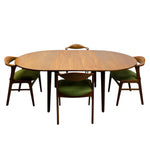Load image into Gallery viewer, Danish Extended Wooden dining table with four matching chairs on a white background
