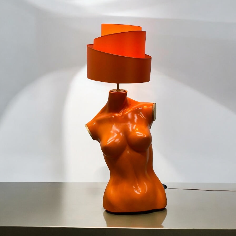 Vintage Orange lamp shaped like a female torso on a white background