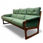 Load image into Gallery viewer, Green sofa with wooden frame on a white background
