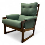 Load image into Gallery viewer, Green armchair with wooden frame on a white background
